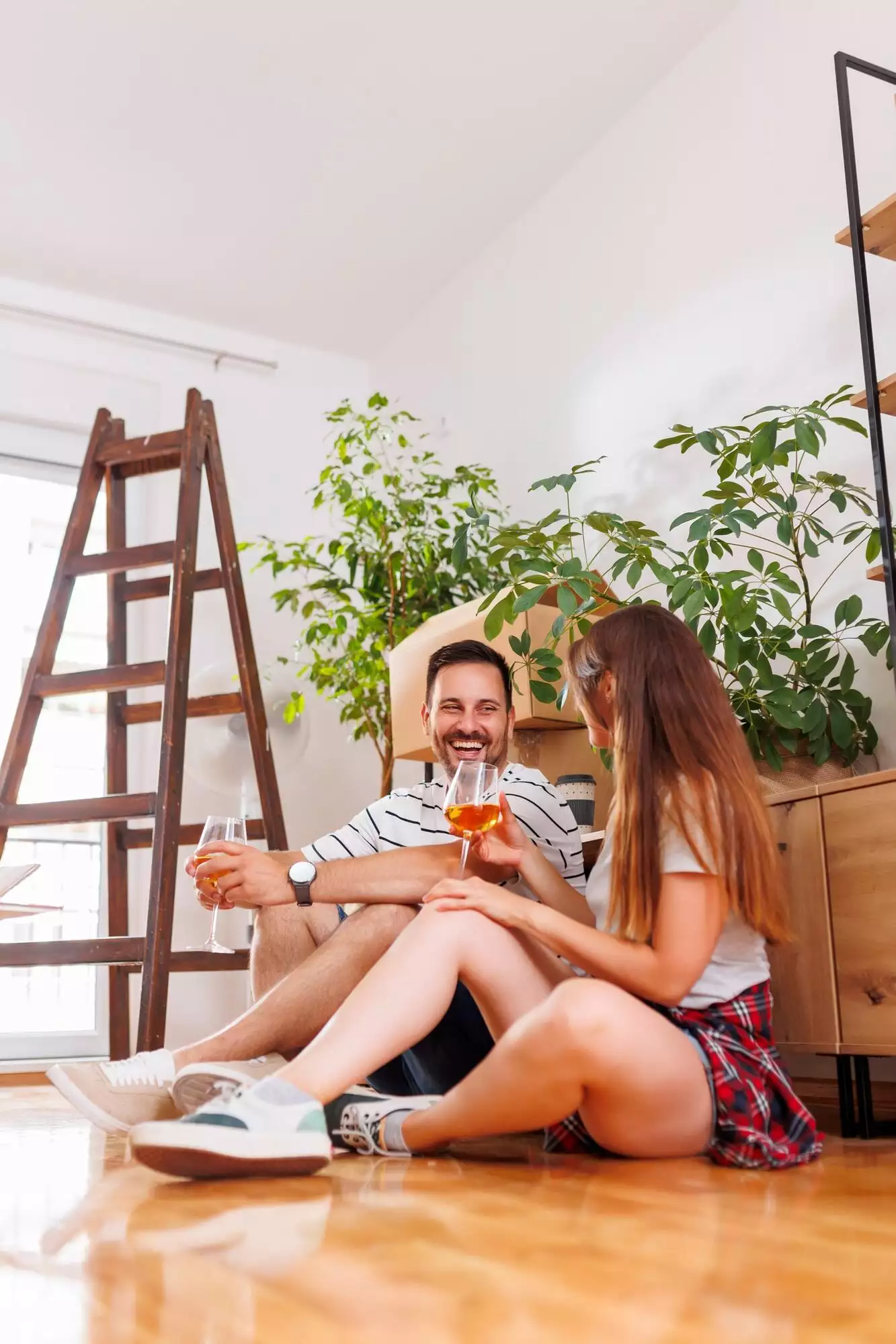 Couple relaxing while moving in new home together